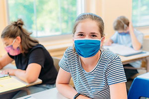 Children in a Sanitized and Disinfecting School Wearing Masks